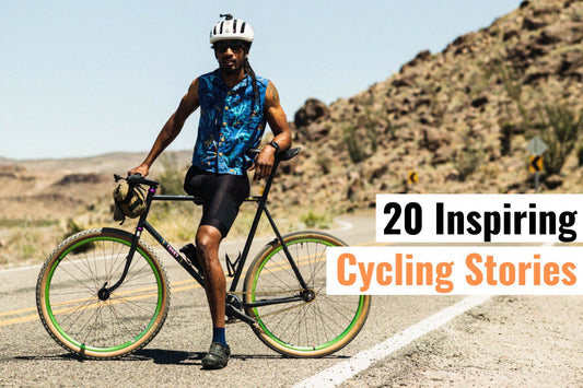 Cyclist standing with bike on desert road, representing resilience, determination, and 20 inspiring cycling stories of overcoming challenges.