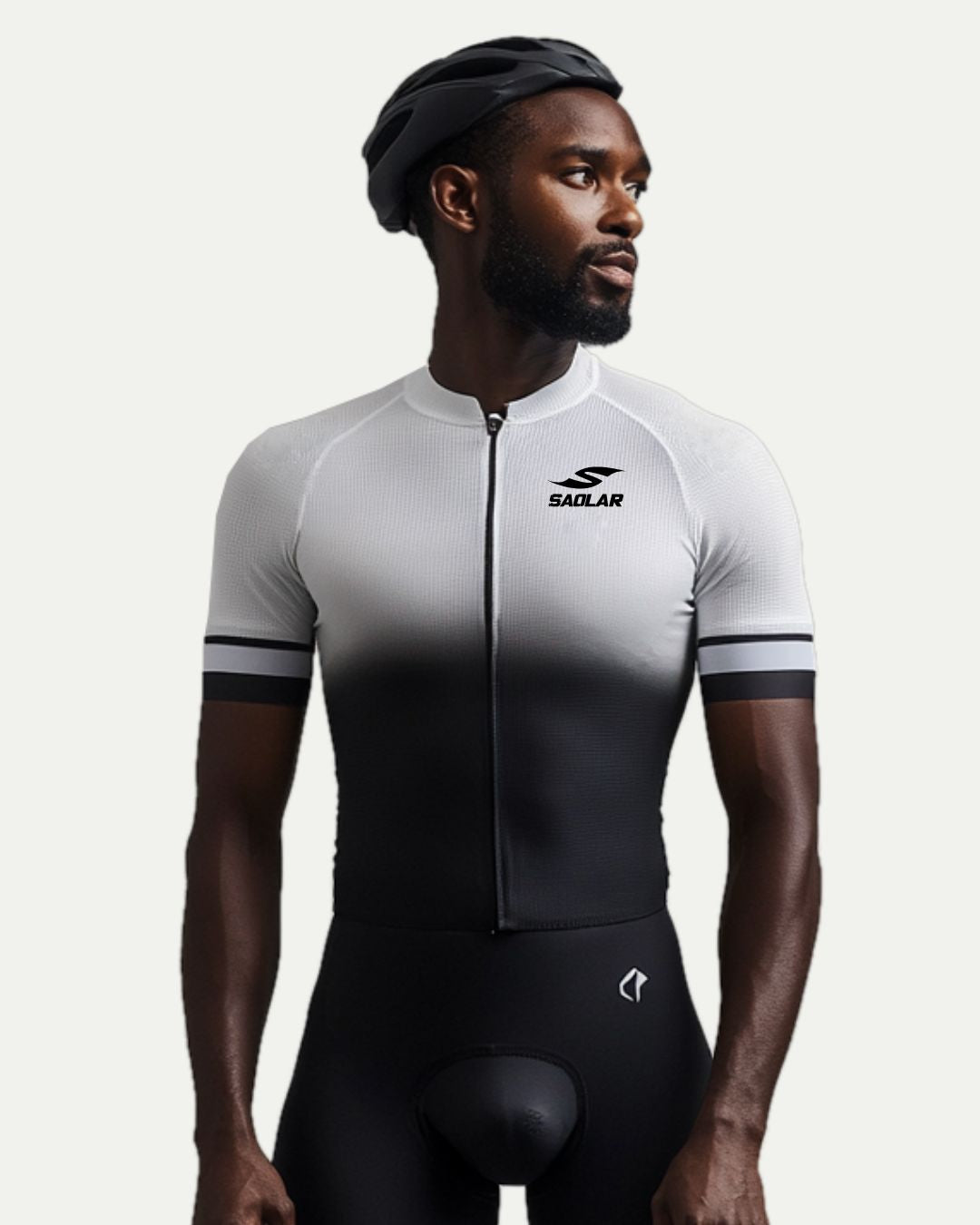 Male cyclist wearing SAOLAR gradient cycling jersey, sleek black-to-white design.