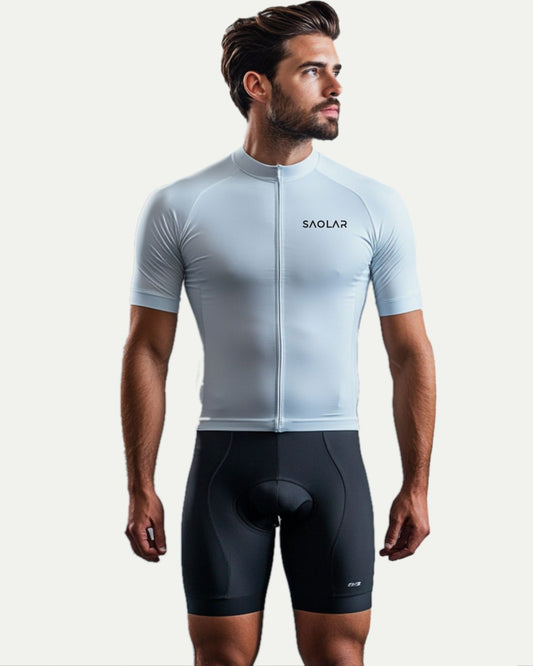 Male cyclist wearing SAOLAR sky-blue minimalist cycling jersey, sleek design.