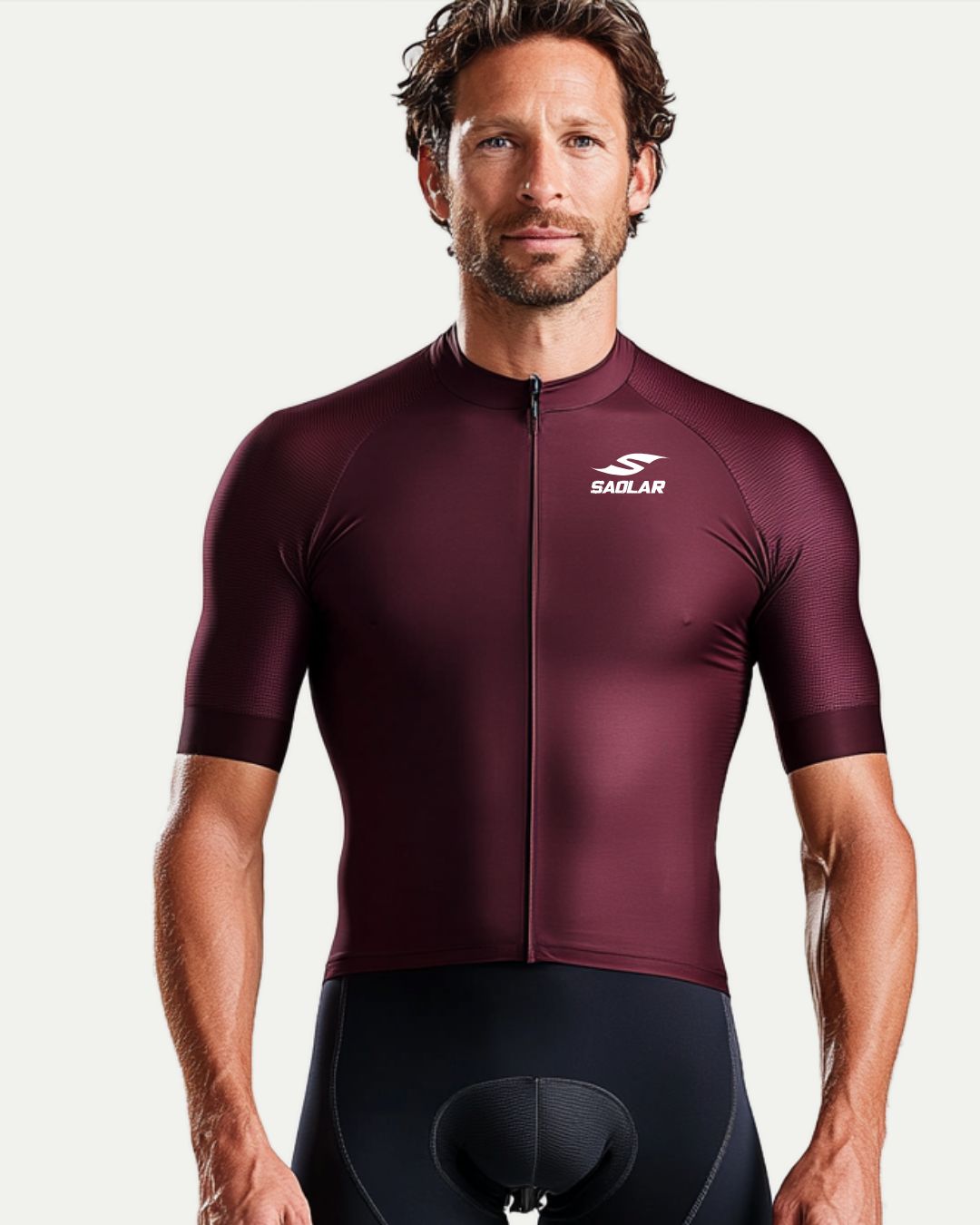 Cyclist wearing SAOLAR burgundy cycling jersey, sleek race-fit design.
