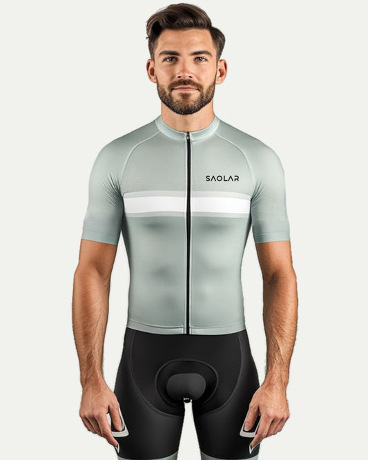 Cyclist wearing SAOLAR gray cycling jersey with white chest stripe.