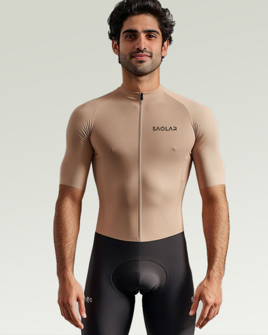 Cyclist wearing SAOLAR beige cycling jersey with a race-fit design.