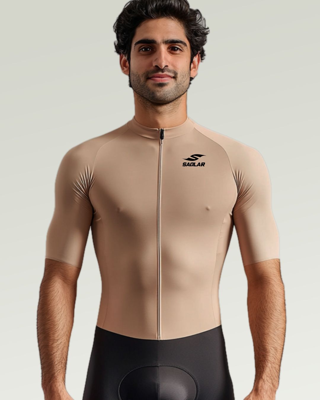 Cyclist wearing SAOLAR beige cycling jersey with a race-fit design.