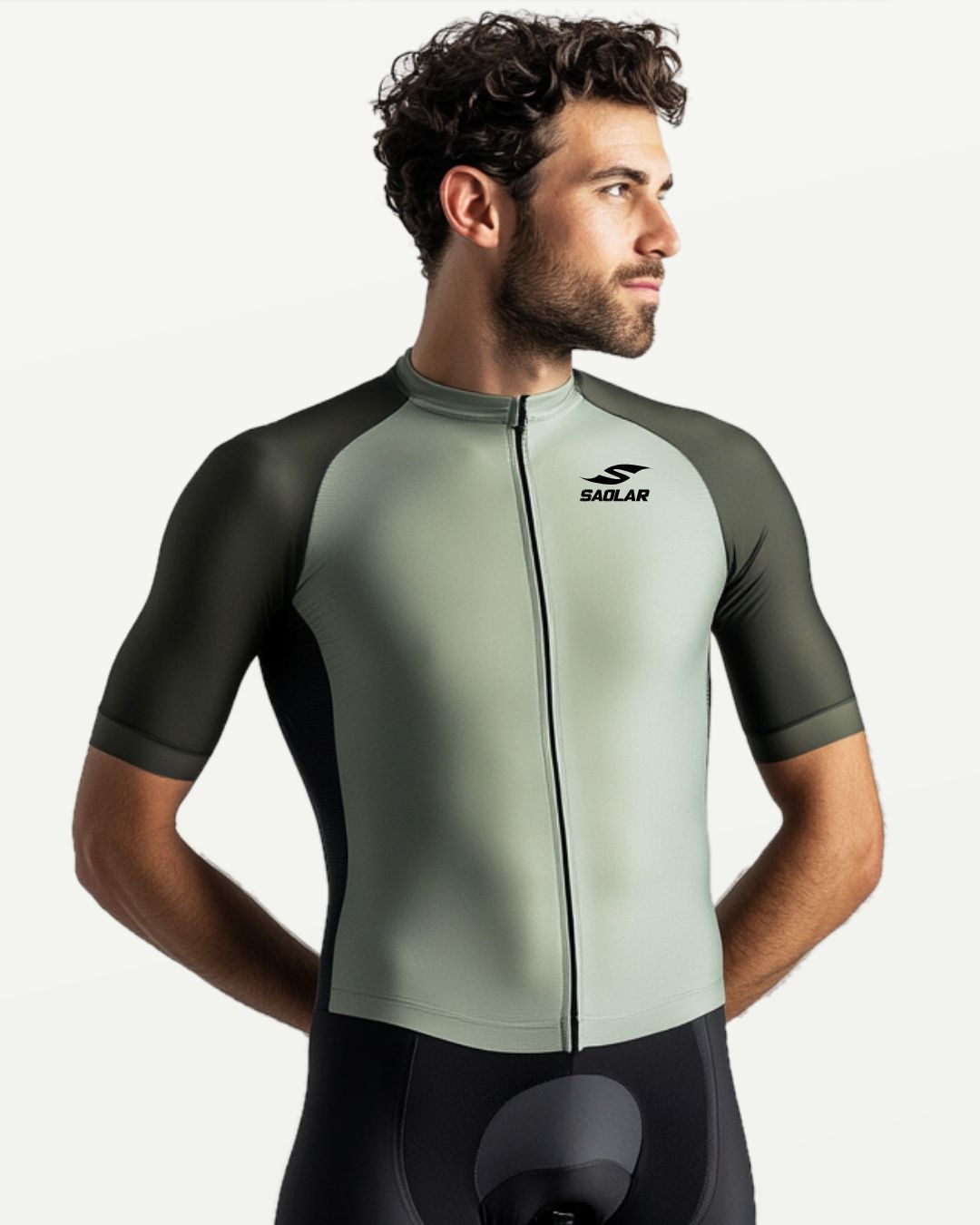 Cyclist wearing SAOLAR sage green and olive cycling jersey, sleek fit.