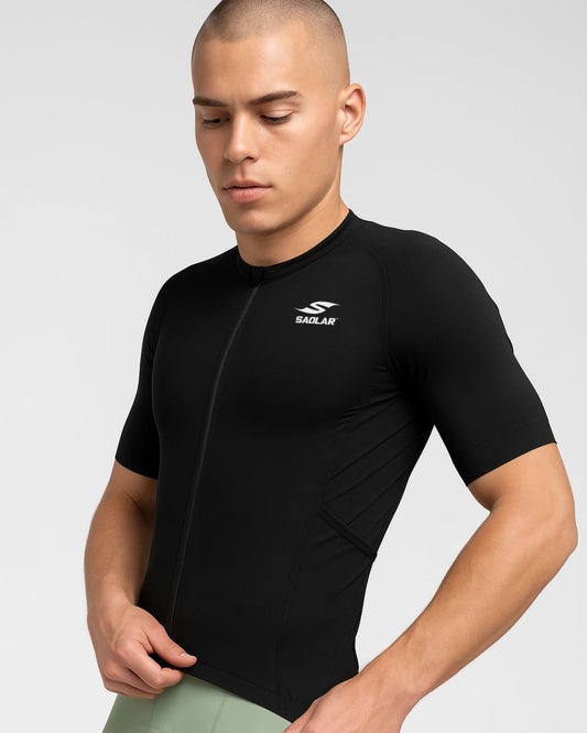 Man wearing the SAOLAR SR2 Eclipse black cycling jersey with short sleeves, sleek aerodynamic fit, and minimalist modern style.