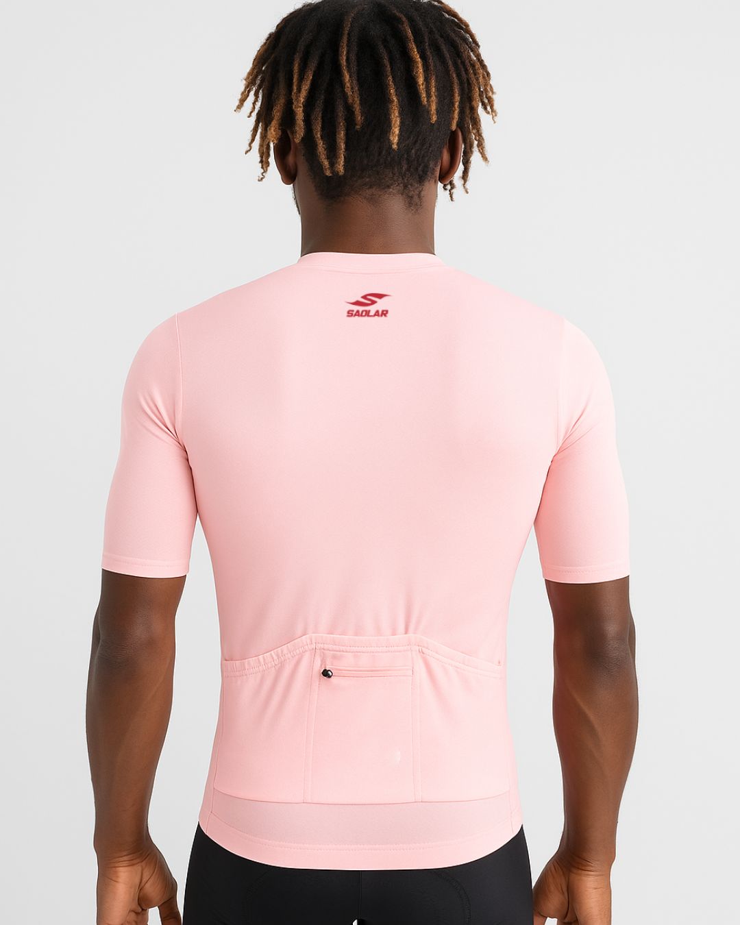 Back view of the SAOLAR SRX Cascade pink cycling jersey featuring rear pockets and performance-focused design.