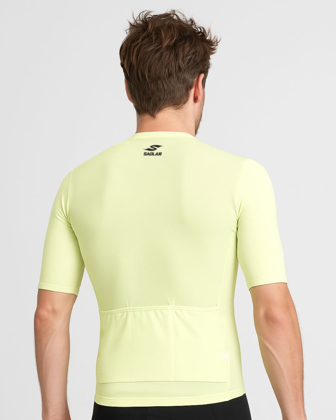 Back view of the SAOLAR SRX Nomad light yellow cycling jersey featuring rear pockets and streamlined performance design.