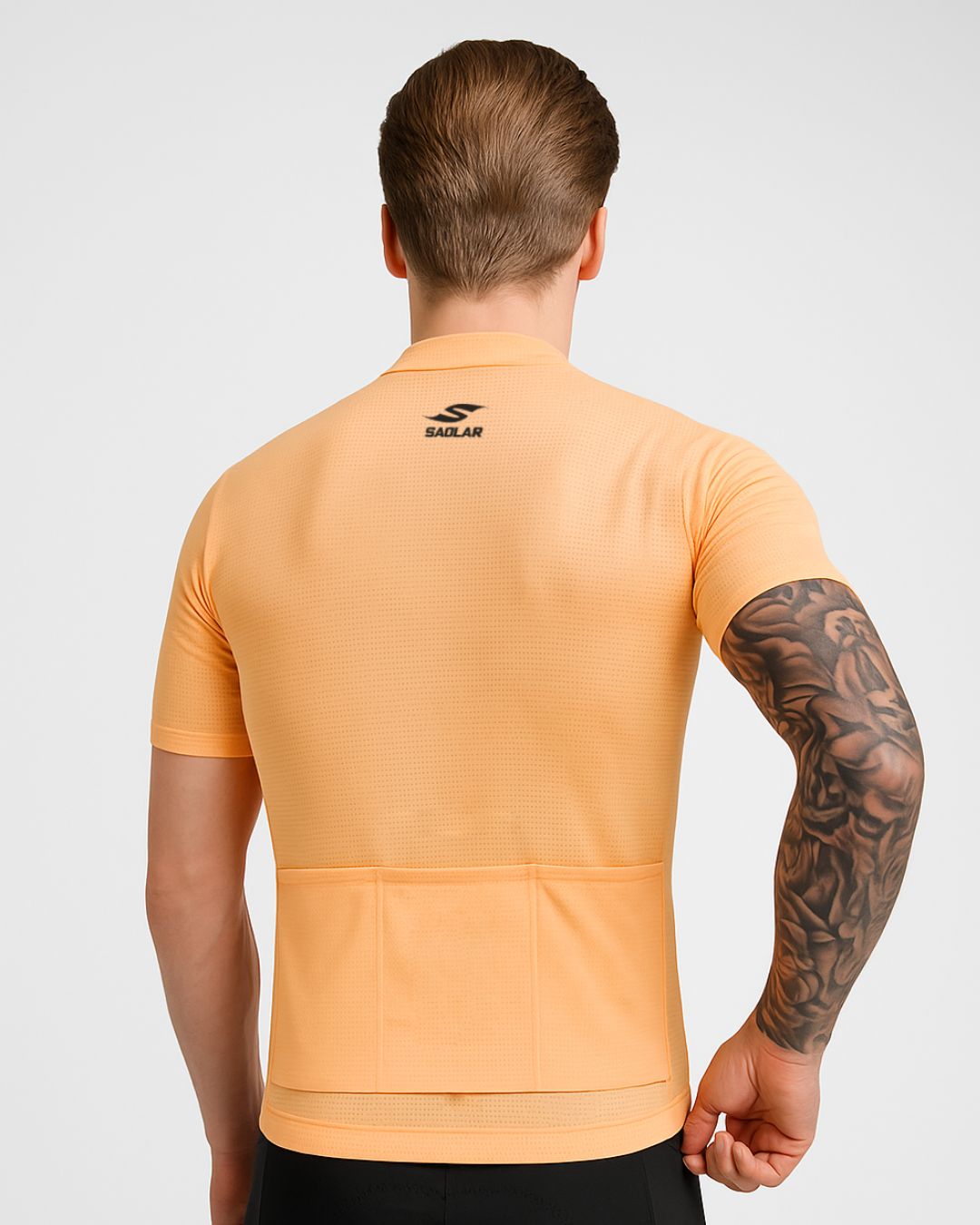 Back view of the SAOLAR S2 Velocity orange cycling jersey featuring rear pockets and performance-focused design.