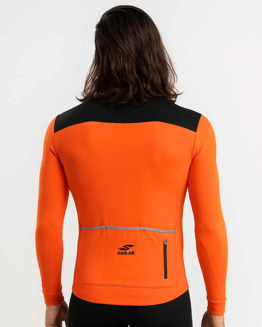 Back view of the SAOLAR S2 Granite orange and black long sleeve cycling jersey featuring rear pockets and performance fit.