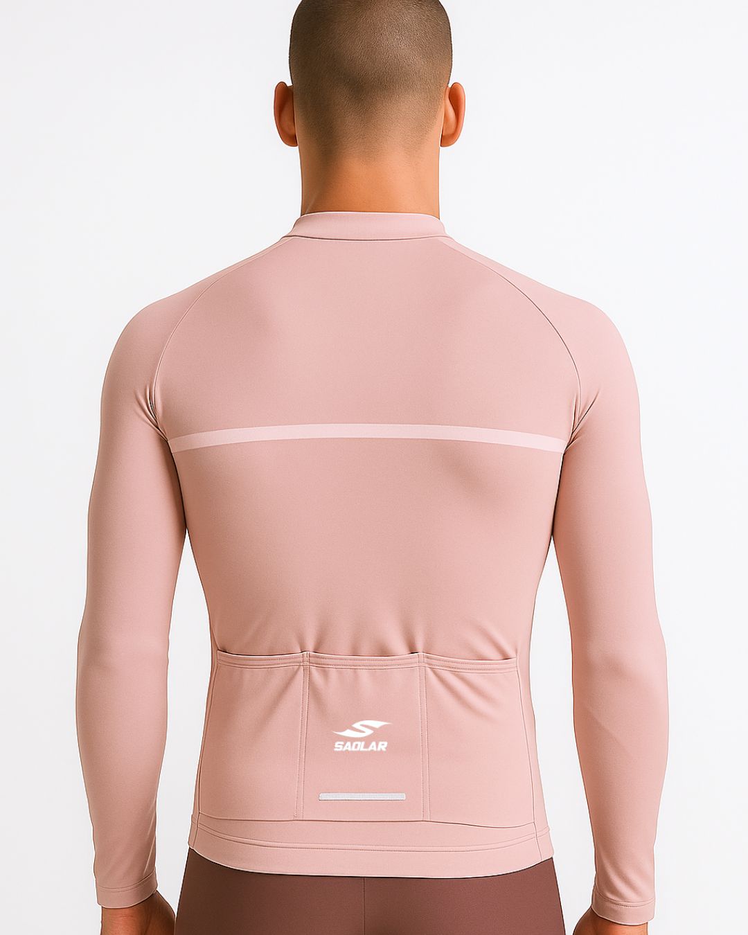 Vista posteriore della maglia da ciclismo SAOLAR S4 Emberfall rosa cipria a maniche lunghe con tasche posteriori e design minimalista.