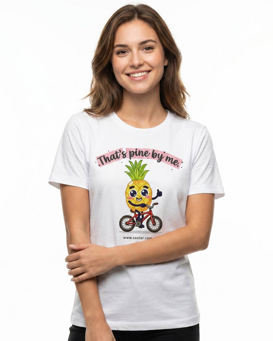 SAOLAR women’s white cotton t-shirt featuring “That’s Pine by Me” slogan with cute pineapple cyclist graphic. Soft breathable fabric, casual fit, short sleeves. Stylish lifestyle apparel for cycling lovers, fun summer outfit, comfortable everyday wear, high-quality print, trendy graphic tee, minimalist white background product photo showcasing design clearly.