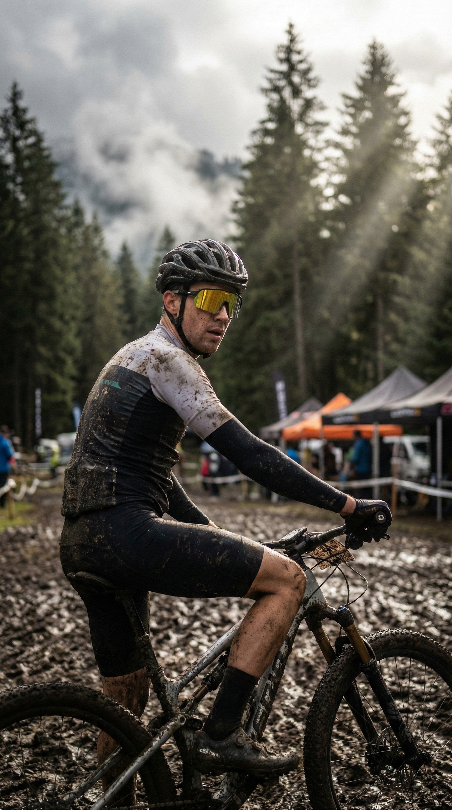 Mountain biker wearing SAOLAR yellow mirrored sunglasses riding through muddy race course, forest background, intense outdoor competition atmosphere, performance cycling eyewear in action.