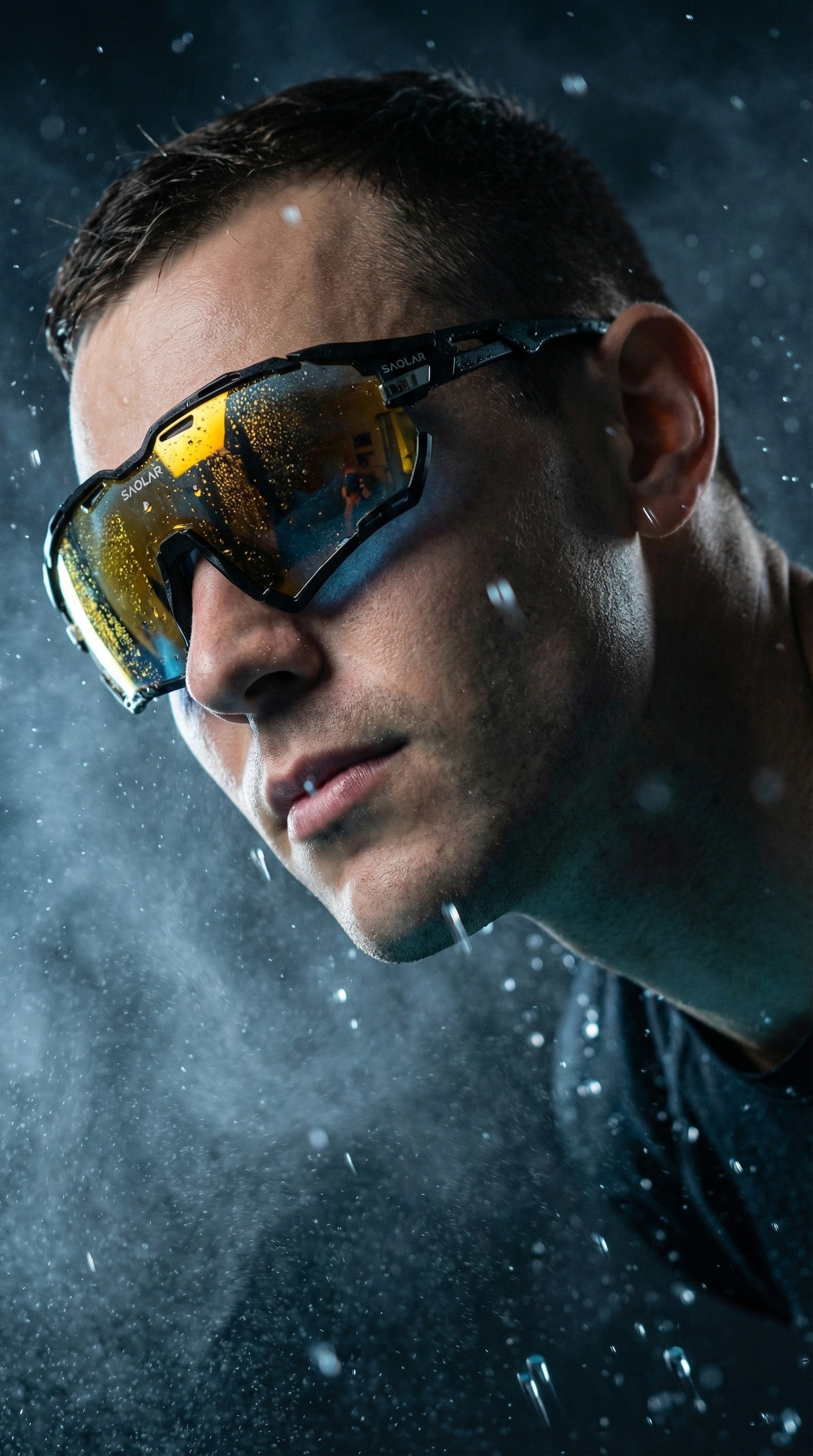 Close-up portrait of athlete wearing SAOLAR sports sunglasses with yellow mirrored lenses, rain droplets, dramatic lighting, intense expression, performance eyewear in dynamic outdoor atmosphere.