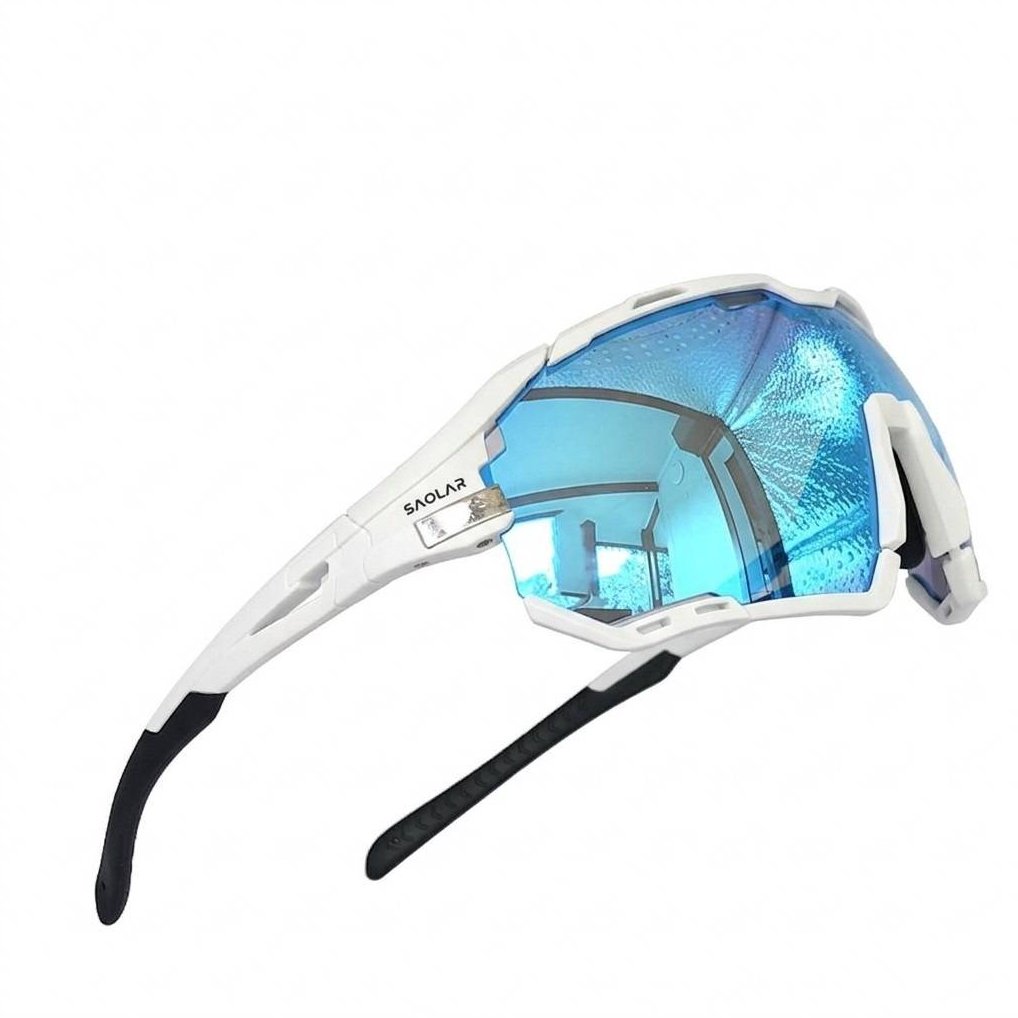SAOLAR Rapture ICE sport sunglasses product shot — white wraparound frame with Full Revo Blue photochromic lenses and black rubber temple tips. Angular polycarbonate design with removable rim system. UV400 protection, anti-fog ventilation, prescription-compatible. Built for cycling, triathlon, and outdoor performance.