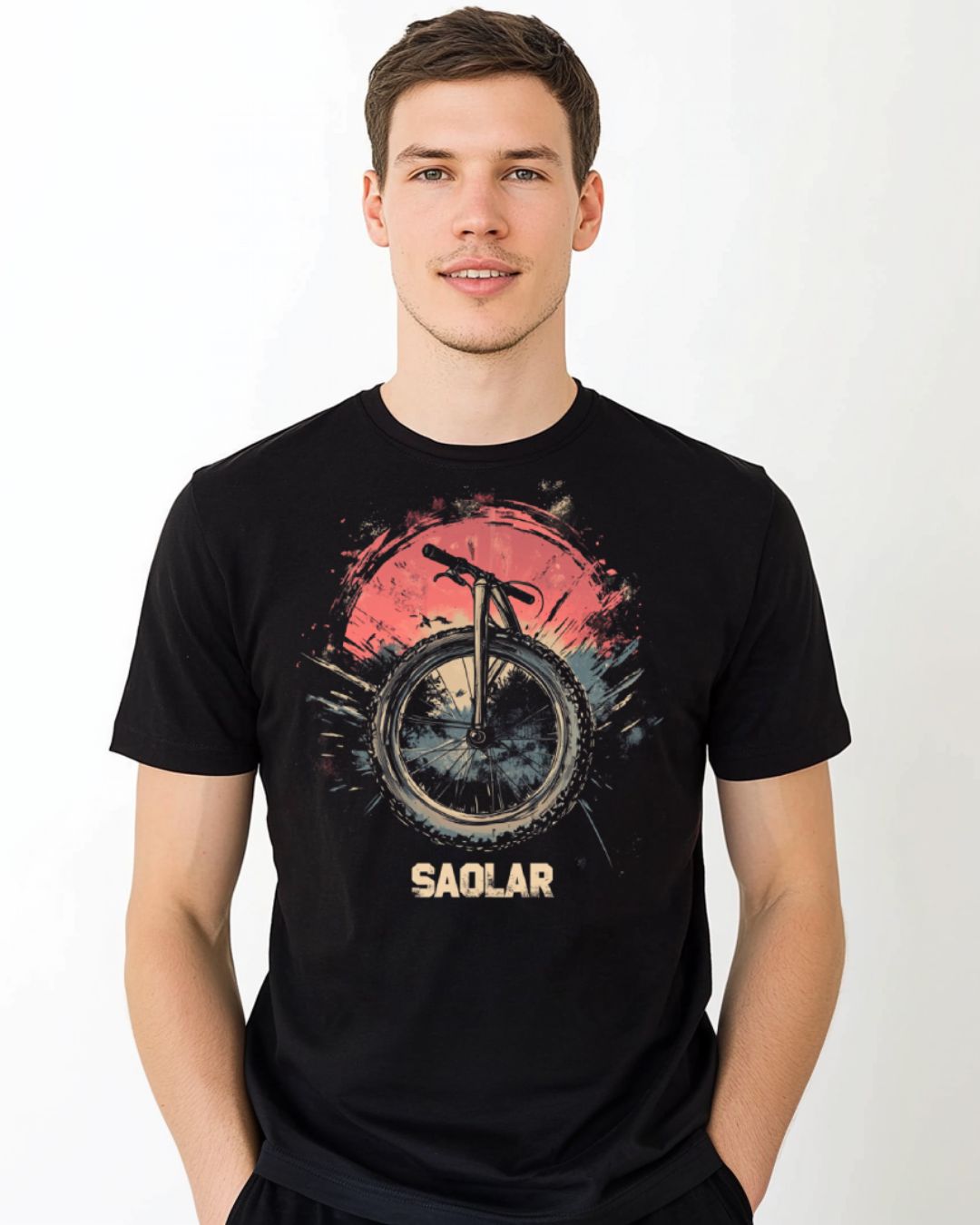 Rugged bike wheel against sunset on WheelFire adventure t-shirt.