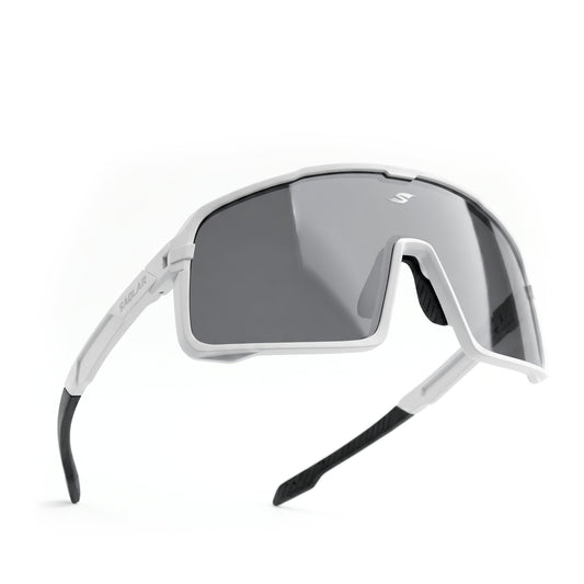 SAOLAR Shadelane cycling sunglasses in white, shown in a clean studio product shot. The oversized wraparound shield lens features a dark smoke tint with subtle mirror finish, angular white frame accents, black rubber nose pads, and black temple tips. Lightweight aerodynamic design offers wide coverage for cycling and outdoor use.