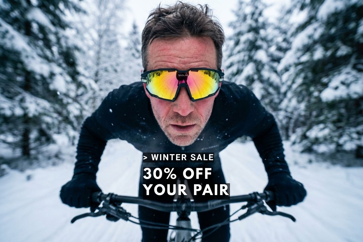 Mountain biker rides through snowy forest wearing SAOLAR sports sunglasses winter sale banner advertising thirty percent discount on eyewear today